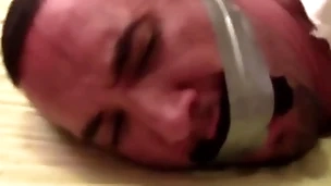 Victor sockgagged and tapegagged tight and captured connected with socks inside his mouth wrapped the tape around his head preview