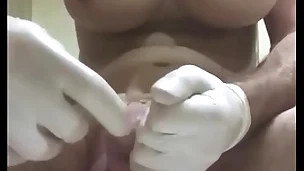 Huge butt plug with condom insertion into urethra