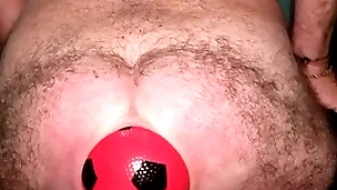 World record 13 cm wide anal stretching with enlarging ball.
